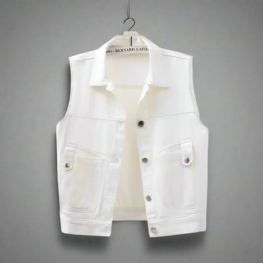 A sleeveless white denim vest with a classic design, featuring a front button closure and dual chest pockets, displayed on a mannequin.