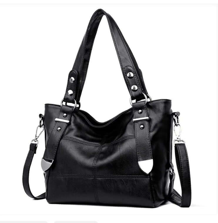 A black handbag with silver accents and adjustable straps for using as a shoulder bag or purse