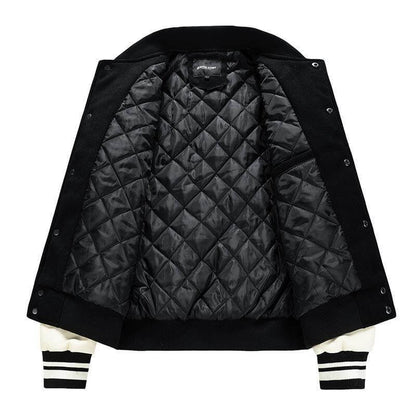 Black quilted jacket with white accents on a white background