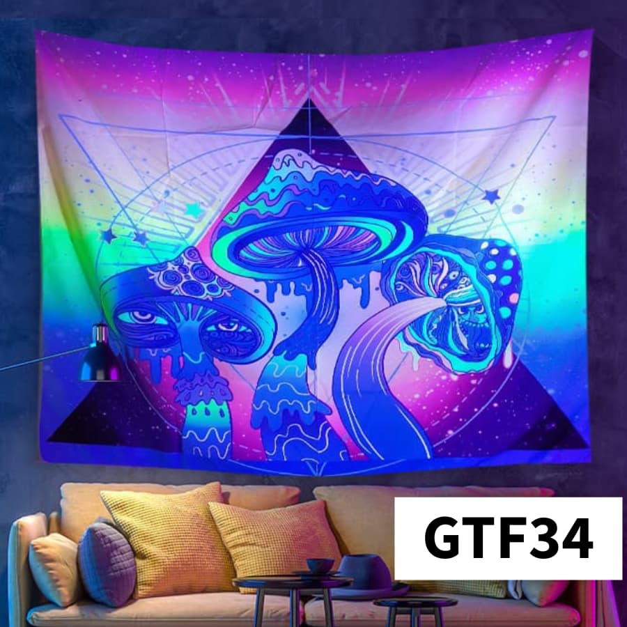 Colorful tapestry with abstract design of a mushroom and skull on a wall above a couch.