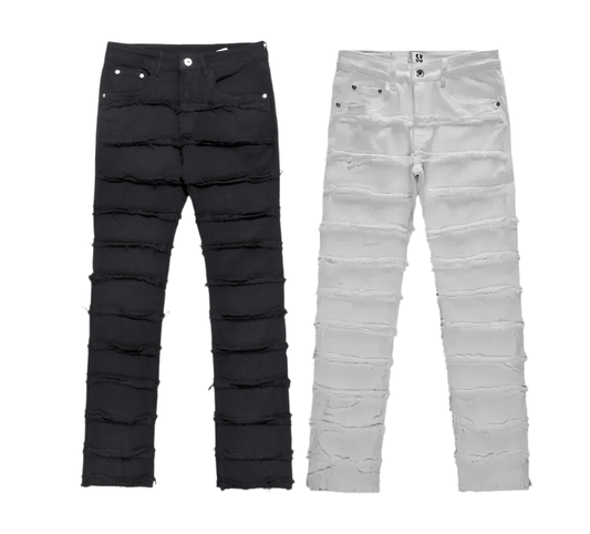 Two pairs of distressed jeans, one black and one white, feature horizontal frayed lines. They are laid flat side by side on a white background.
