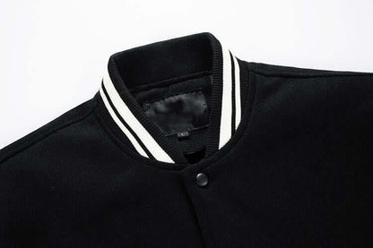 Black jacket with white trim on a white background