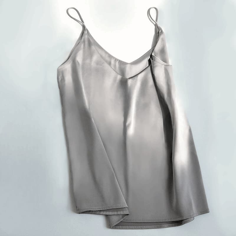 Silver satin slip dress on a white background