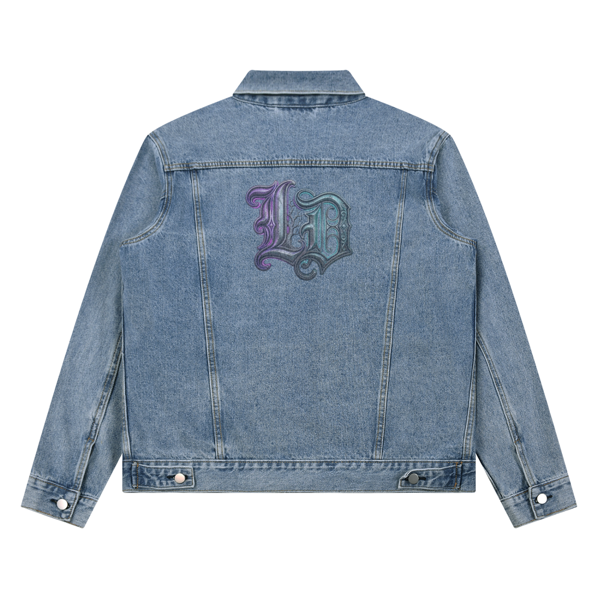 A light blue denim jacket shown from the back, featuring a large decorative gothic logo in a purple-to-green gradient on the upper back.
