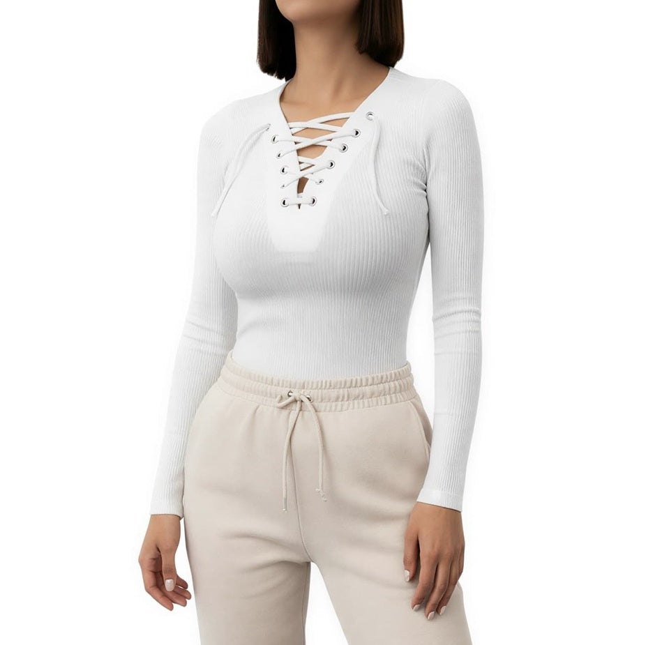 Woman wearing a white lace-up long-sleeve top and beige pants on a white background