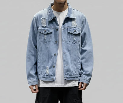 Light blue denim jacket worn by a person on a gray background