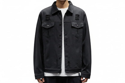 Black distressed jacket worn by a person on a white background